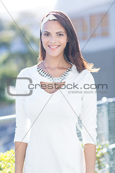 Beautiful woman well dressed smiling at camera