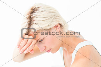 Sad woman crying with hand on forehead