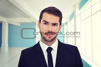 Composite image of portrait of a skeptical businessman well dressed