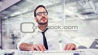 Composite image of business worker with reading glasses on computer
