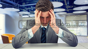 Composite image of anxious businessman