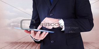 Composite image of smiling businessman in glasses with arms out