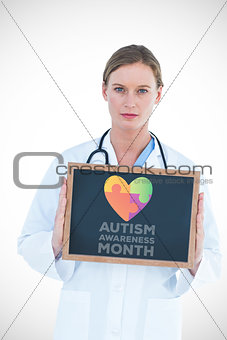 Composite image of doctor showing chalkboard