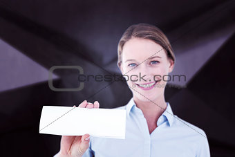 Composite image of businesswoman showing her business card