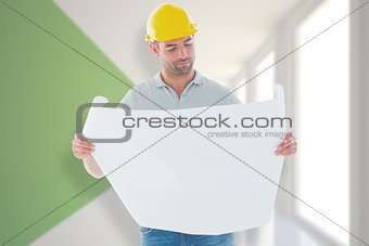 Composite image of architect reading plan