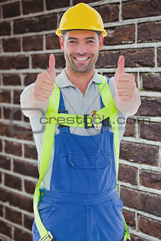 Composite image of builder in safety gear