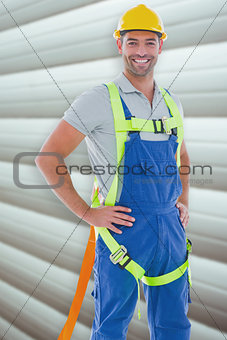 Composite image of builder in safety gear