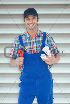 Composite image of plumber holding monkey wrench and sink pipe