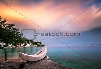 Rainbow over the White Stone Boat and Small Village in Omis Riviera, Croatia