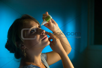 Woman With Eyes Tired Applying Collyrium Eye Drops