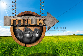 Milk Cans - Wooden Sign with Arrow in Countryside