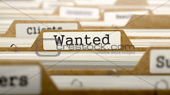 Wanted Concept with Word on Folder.