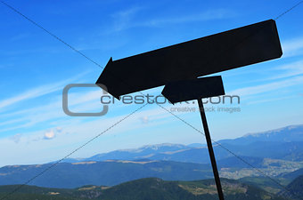 black signboards in mountains