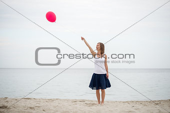 Happy girl holding air balloon