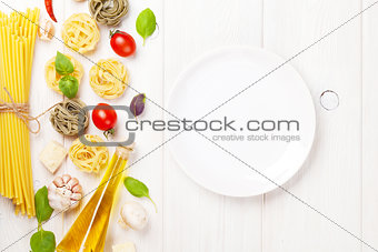 Italian food cooking ingredients and empty plate