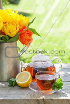 Breakfast tea and colorful tulips bouquet
