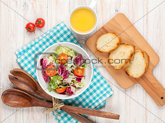 Healthy breakfast with salad, tomatoes and toasts