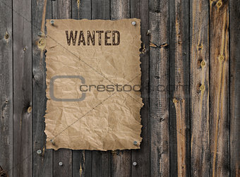 Wanted poster on weathered plank wood wall