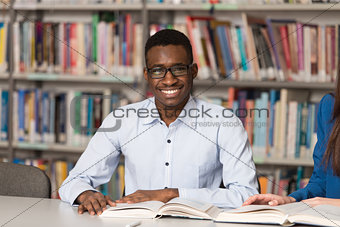 Portrait Of Clever Black Student With Open Book