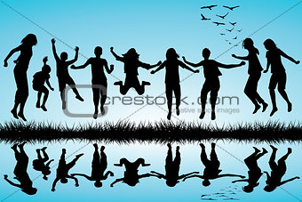 Group of boys and girls jumping outdoor