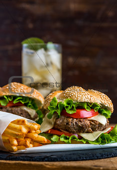 Homemade Hamburger with Fresh Vegetables and Drink with Ice