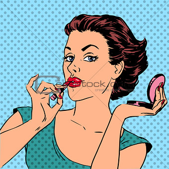 Girl paints lips with lipstick cosmetics beauty perfumes pop art