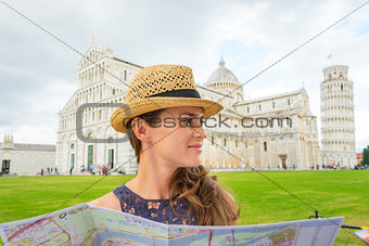 Woman wearing hat in profile holding map in Pisa