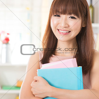 Asian girl with textbooks