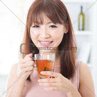Asian girl enjoying tea