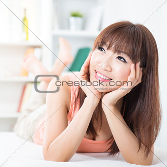 Asian girl daydreaming