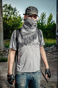 Man covering face with a scarf. Terrorism concept. 