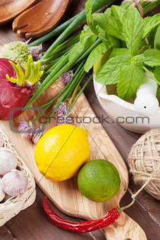 Fresh herbs and spices on table