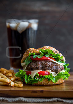 Homemade Hamburger with Fresh Vegetables, French Fries and Drink