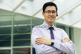 Business Man With Smartwatch And Bluetooth Handsfree Device