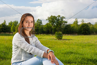 Beautiful teenager on the grass