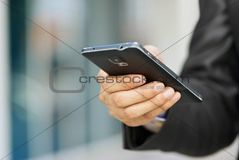 Business Man Holding Smartphone And Watching E-mail