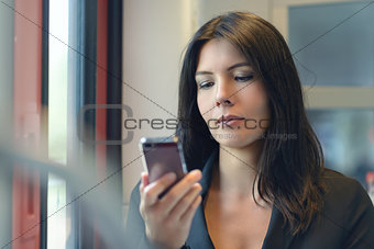 Woman reading a text message on her mobile
