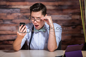Insulted Boyish Woman Looking at Phone