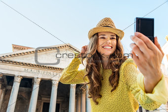 Closeup of woman taking selfie at Pantheon cheering