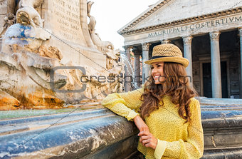 Happy woman tourist standing by the Pantheon fountain in Rome