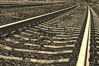 Railroad track into sepia