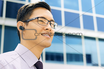 Business Man With Bluetooth Handsfree Device Text Space