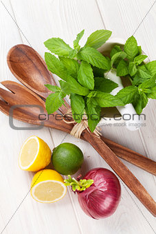 Fresh herbs and spices on wooden table