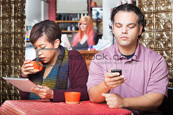 Distracted Couple Using Devices