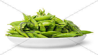 Pile of green peas in pods on white plate
