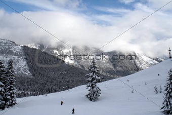 Snow Covered Mountain with skiers