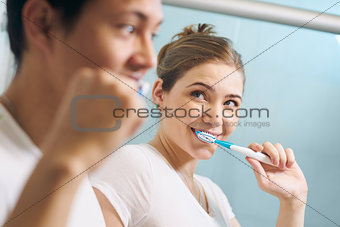 Couple Cleans Teeth Man And Woman Together In Bathroom