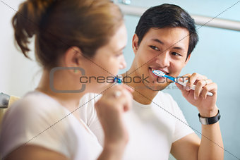 Couple With Toothbrush Man And Woman Washing Teeth Together