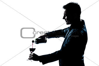 man portrait pouring wine in a glass  silhouette