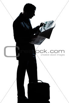silhouette man full length standing reading newspaper
